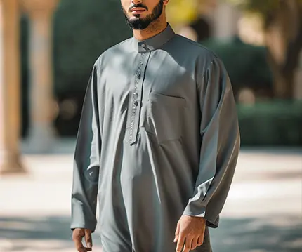 Man in wearing a contemporary grey style formal thobe.